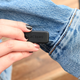 The dongle is thankfully smaller. You can also see the touch-sensitive cuff.